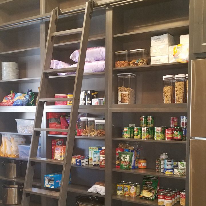 custom pantry shelves with sliding ladder