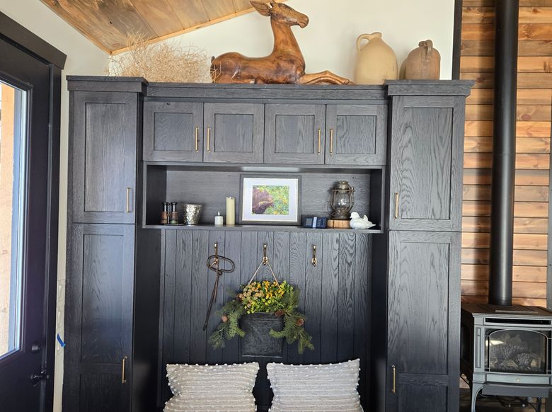 dark built in bench with cabinets