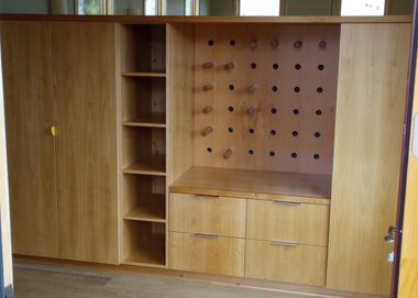 natural finish pegboard clothing storage