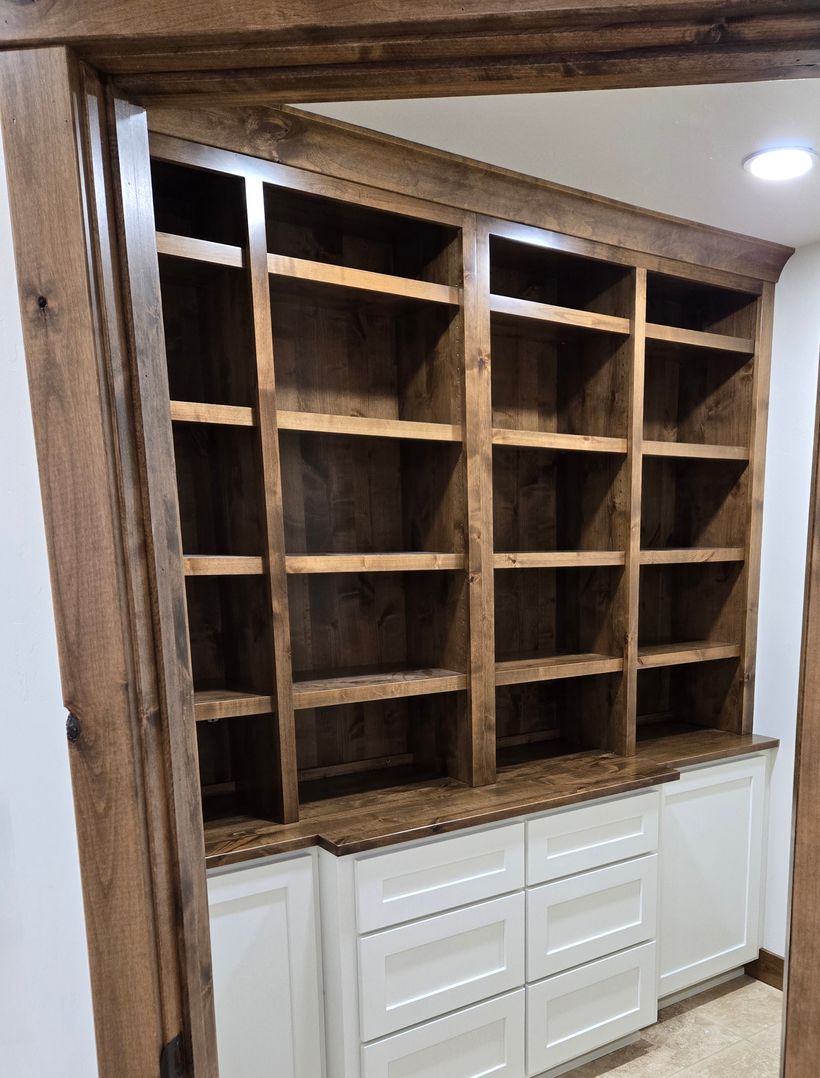 custom dark pantry shelves with white cabinetry