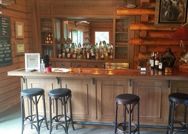 custom warm brown bar and bar storage