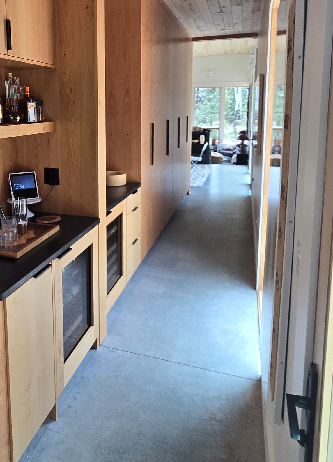 large custom pantry shelves and cabinets in a mountain home hallway