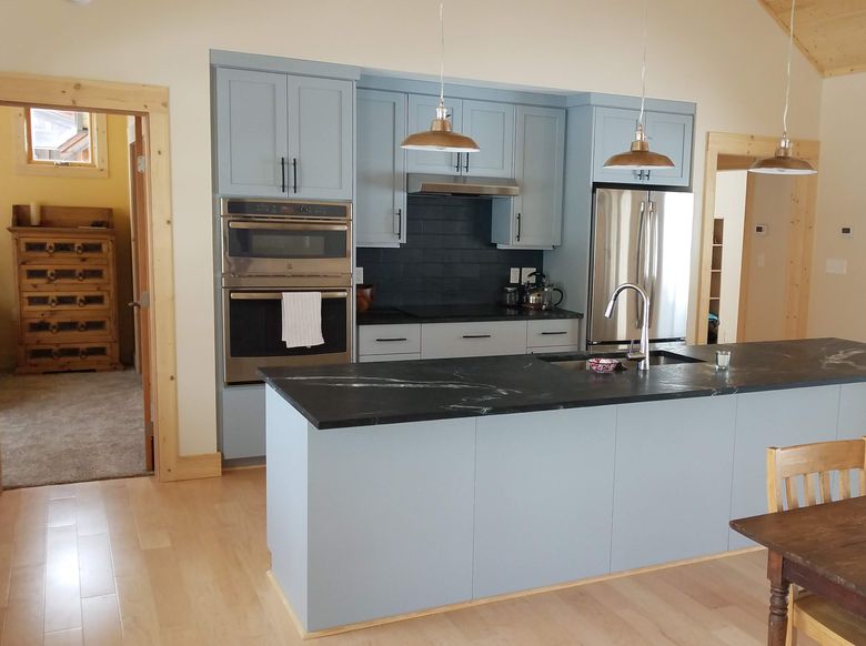 wormy chestnut custom cabnetry in a spacious kitchen