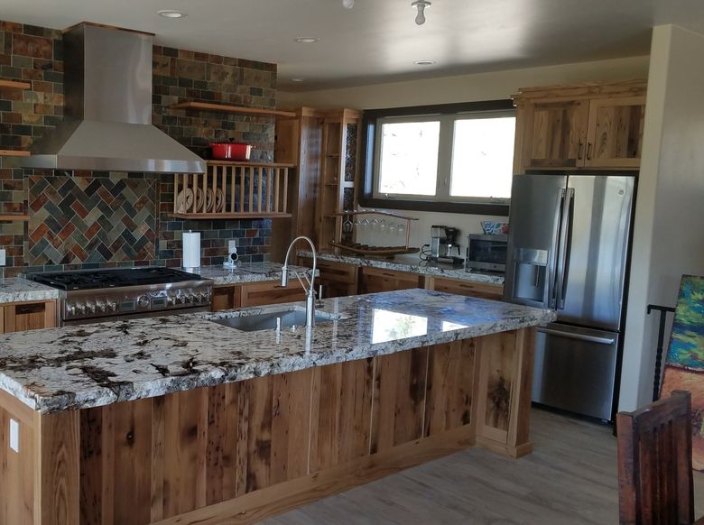 light distressed custom cabinets in a cozy kitchen