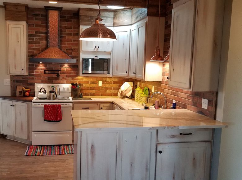 wormy chestnut custom cabnetry in a spacious kitchen