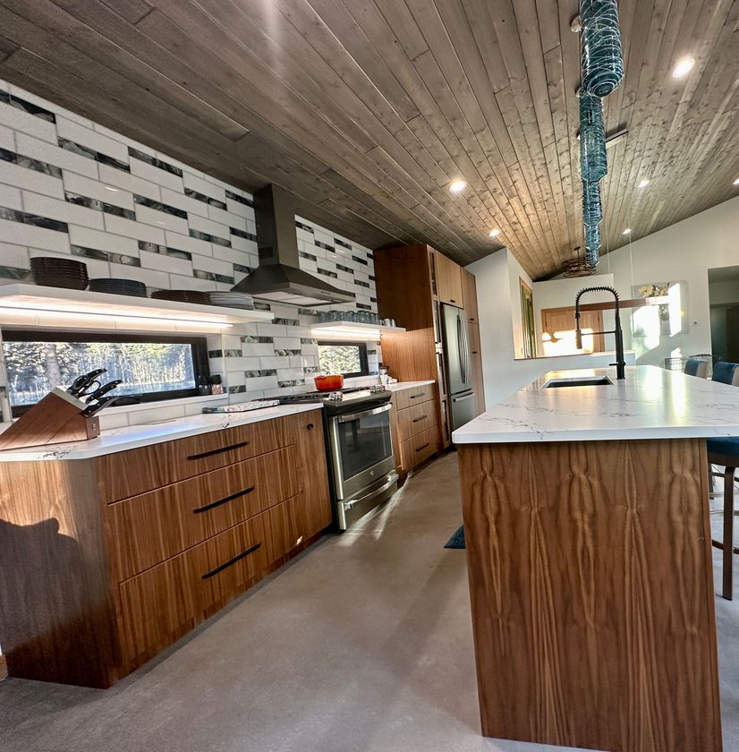 modern kitchen cabinets with white and black backsplash