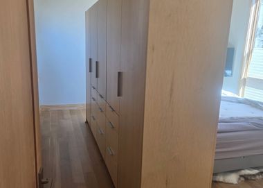 floor to ceiling custom maple wardrobe for bedroom storage